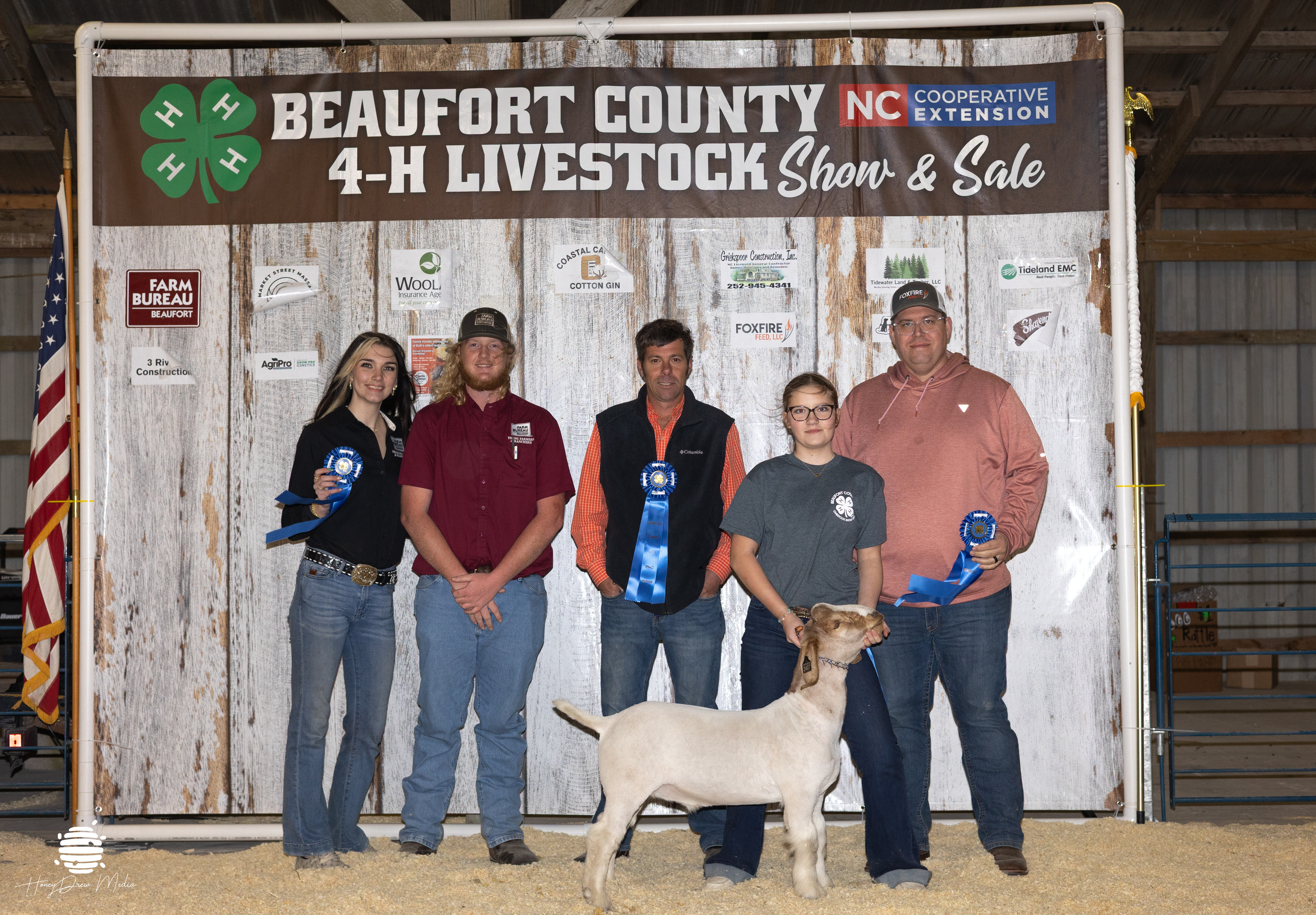 youth and animal with buyers